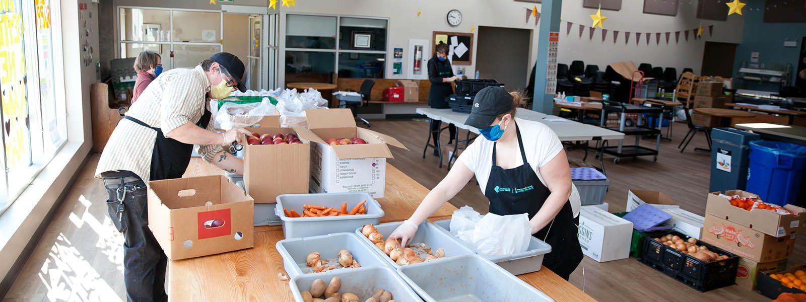 Image of a group of workers preparing food at the North Grove Community Centre in Dartmouth. Image of a group of workers preparing food at the North Grove Community Centre in Dartmouth.